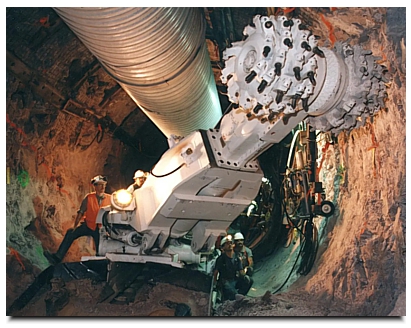A mining machine excavates alcoves and niches for exploratory scientific testing at Yucca Mountain. Credit: US Department of Energy